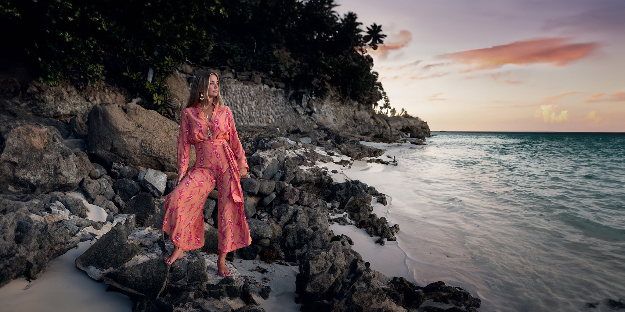 Evening dresses, occasion wear, and silk resortwear classics inspired by the low-key luxury lifestyle of Mustique in prints and colours inspired by the Caribbean nature of island and its surrounding seas.