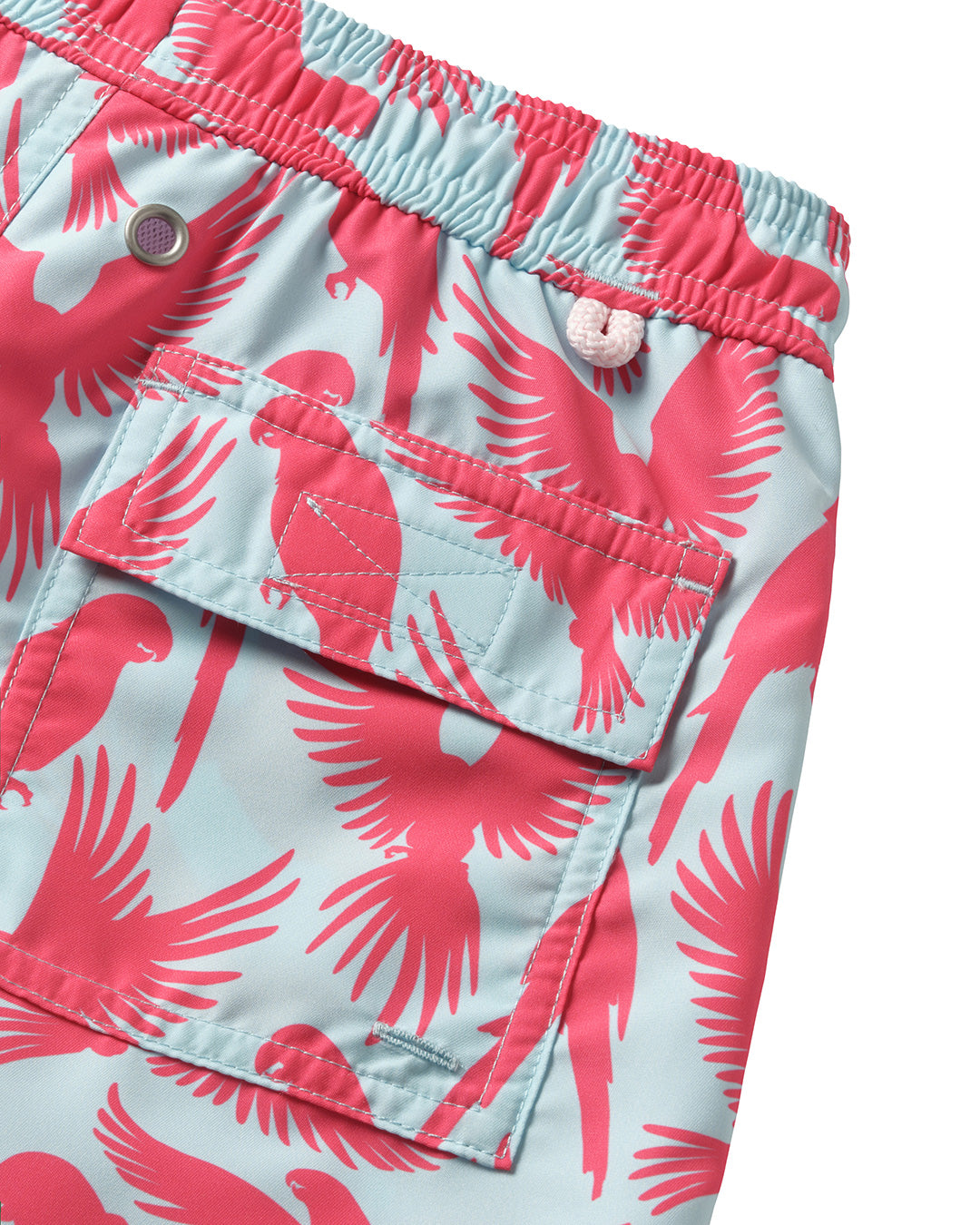 Boys swim shorts back pocket detail in turquoise blue and coral red Striped Shell print by designer Lotty B