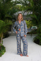 Luxurious pure silk pyjamas in gold and navy blue pomegranate print. Limited edition collections by Lotty B Mustique