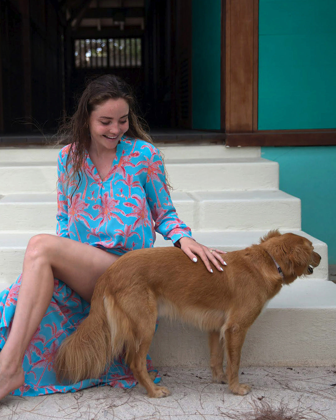 Mustique island lifestyle pure silk Kim blouse in Plantation sunset orange and turquoise print worn with matching palazzo pants by designer Lotty B for Pink House