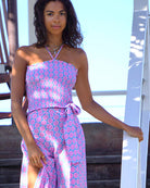 Luxury vacation style silk shirred bandeau top in Lime Slice blue and pink print with matching  Gabija palazzo pants by designer Lotty B Mustique