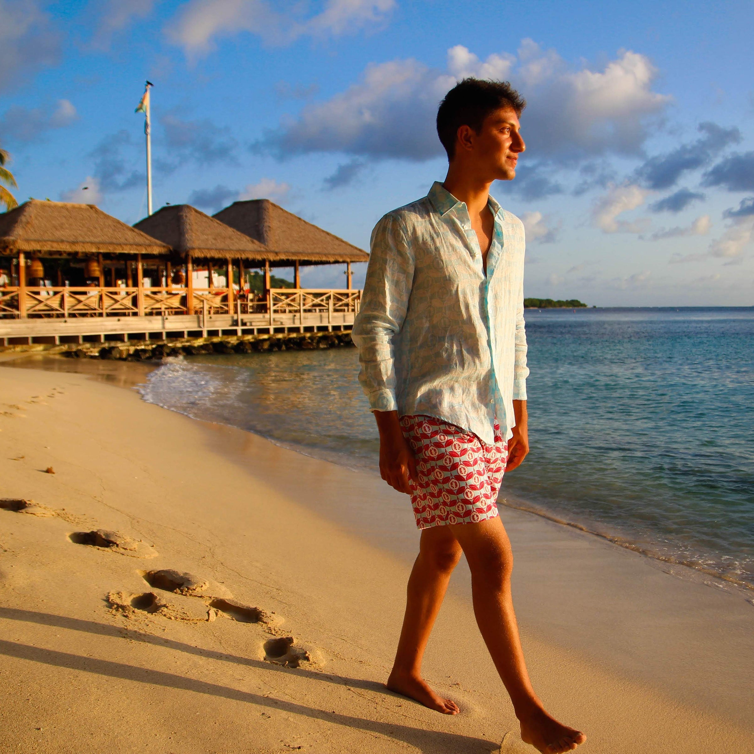 Mens designer swim wear Guava red print by Lotty B Mustique Beach by Basils