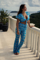 Island beach style silk pants & top outfit in Lurcher green & blue print by designer Lotty B Mustique