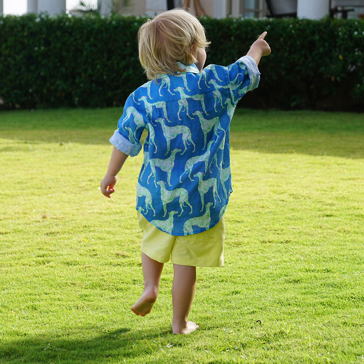 Kid's soft linen shirt in Lurcher blue & green print paireed with solid yellow swim trunks