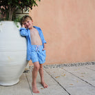 Kid's vacation packing essentials French blue linen shirt & swim shorts in blue Striped Shell print by designer Lotty B