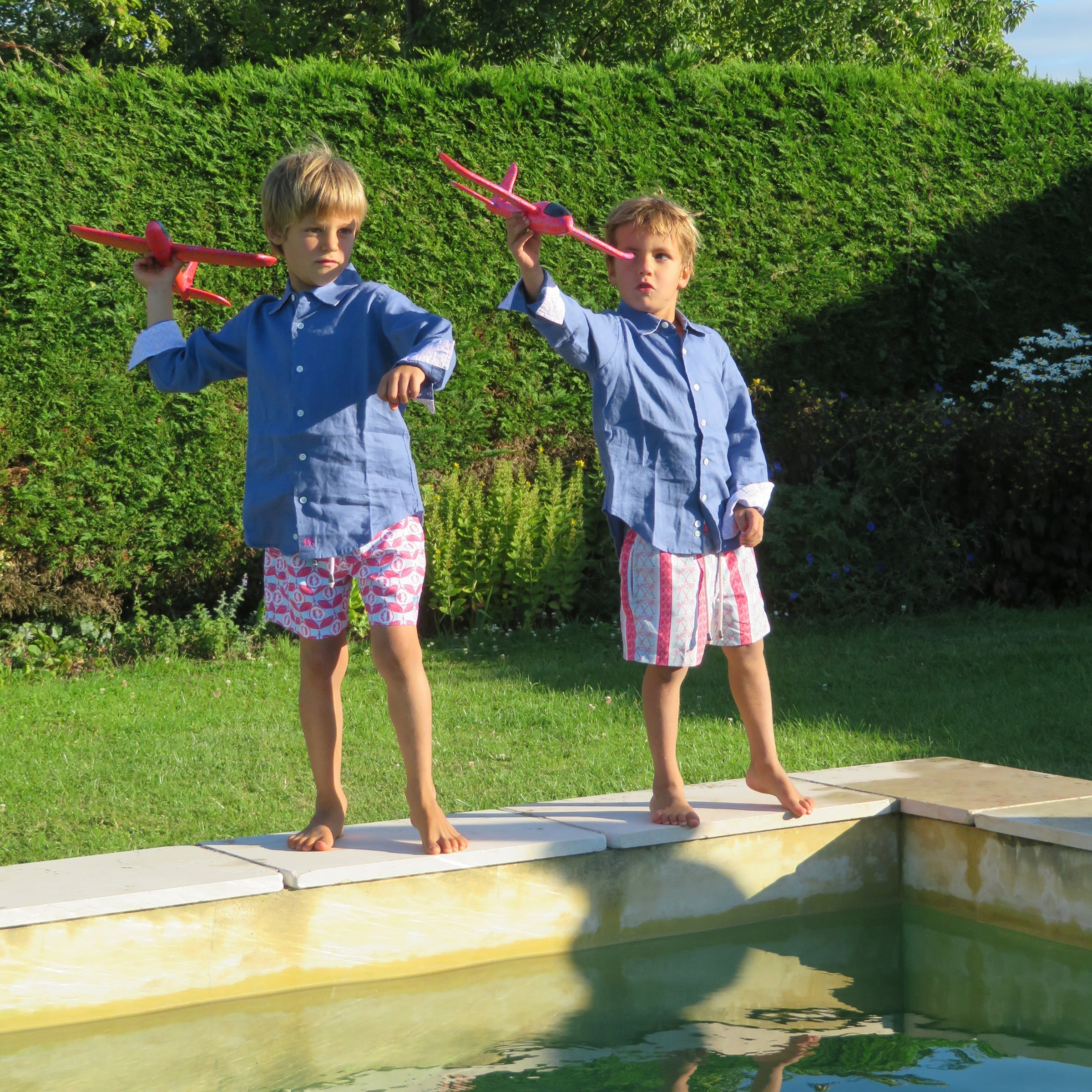 Childrens pure linen navy blue shirt & red blue logo palm stripe print swim shorts by Lotty B for Pink House Mustique, childrens resort fashion