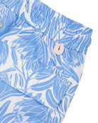 Back pocket detail of kids swim shorts recycled fabric in floral protea blue and white print