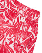 Back pocket detail of kids swim shorts recycled fabric in floral protea red and white print