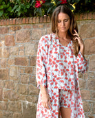 From bed, straight to beach in this Pink House silk pale blue and orange Flamboyant Flower print robe, top and shorts set by designer Lotty B