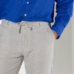 Drawstring linen pants worn with dazzling blue collarless linen shirt by Pink House resortwear