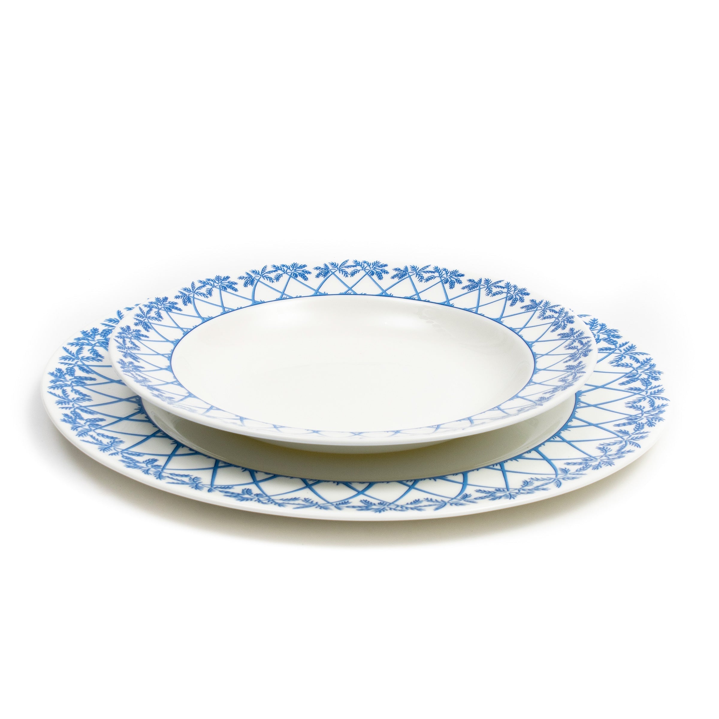 23cm rimmed bowl placed on 30cm dinner plates in fine bone china Palms blue design