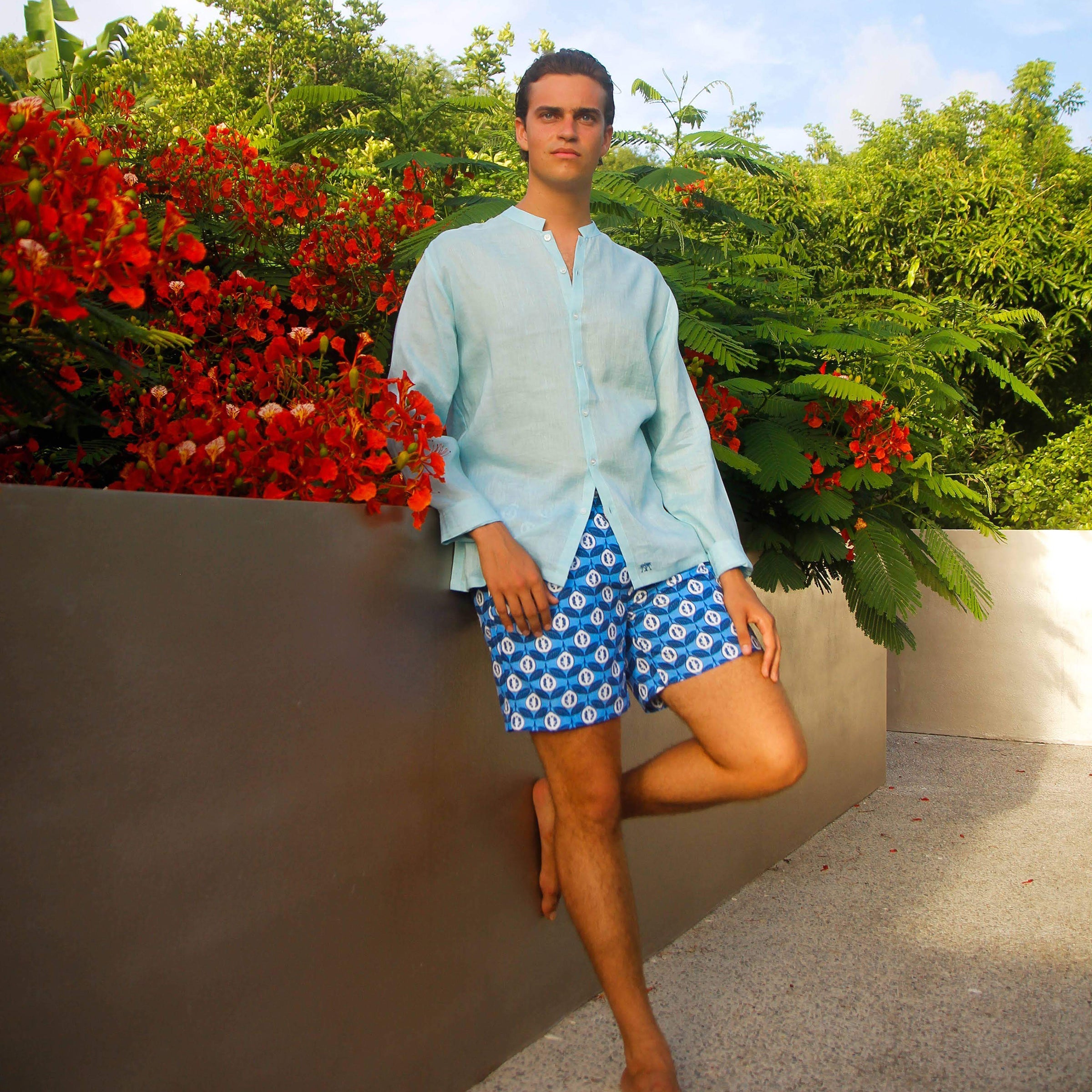 Mens designer swim trunks in Guave blue by Lotty B Mustique resort clothing