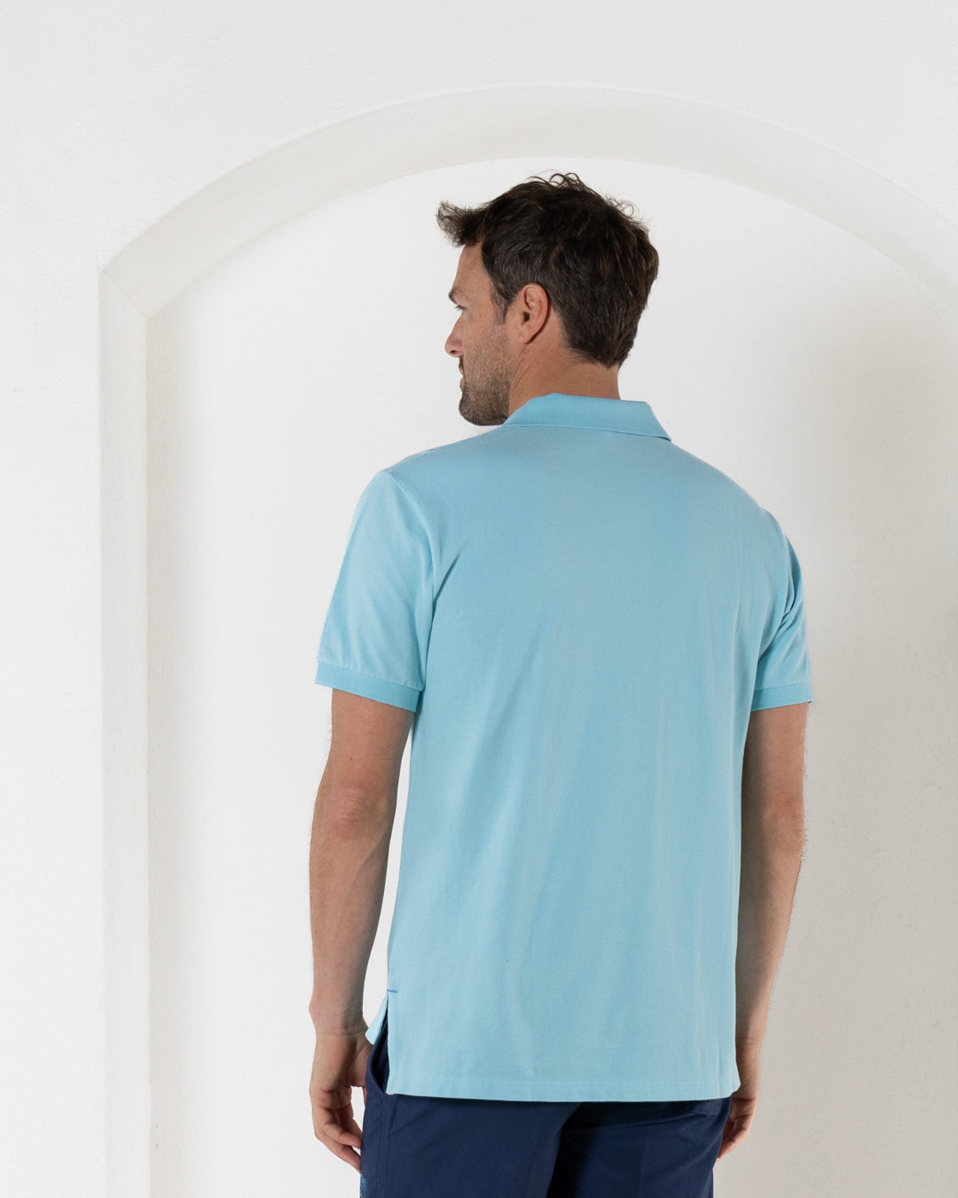 Back view of premium quality bright blue pure cotton polo shirt