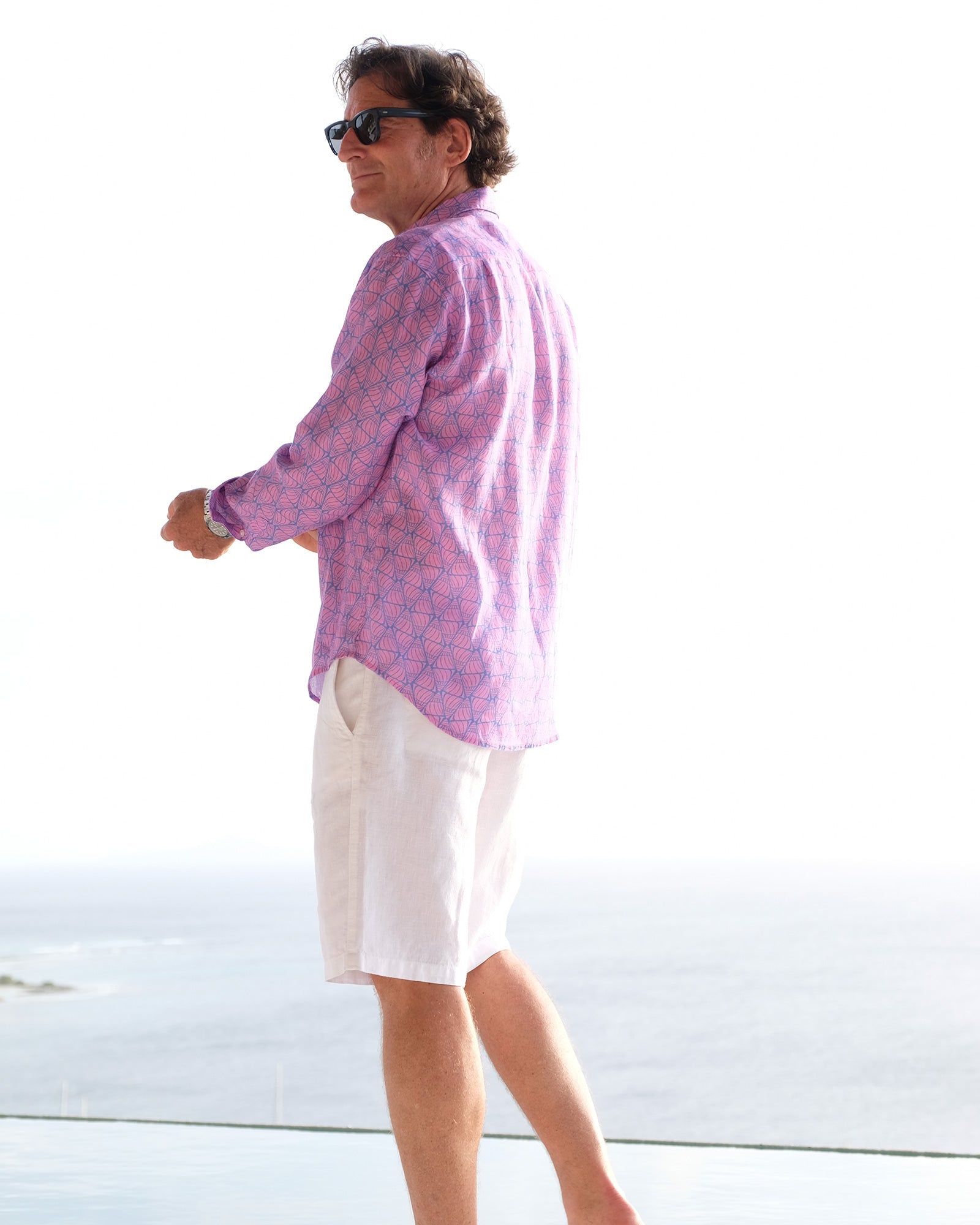 Caribbean island style men's linen shirt in blue and pink Shelltop print