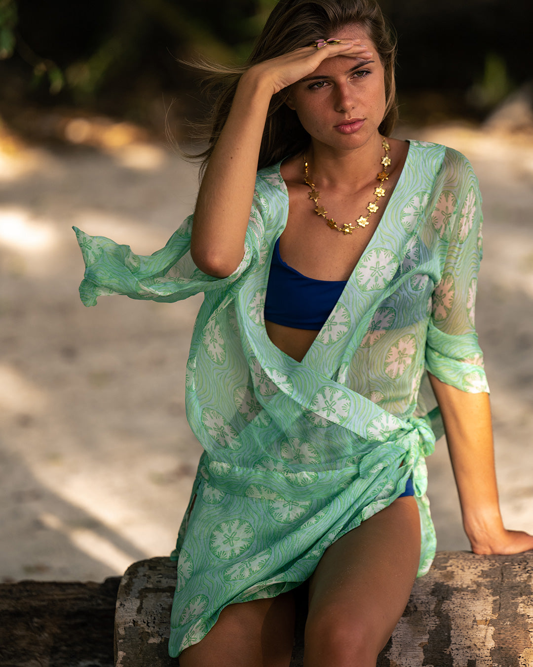 Luxury island vacation, Lottie Cecil styles a green Sand Dollar chiffon silk Kimono cover-up with Squeeze jewellery, Lagoon Bay Mustique.