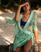 Luxury island vacation, Lottie Cecil styles a green Sand Dollar chiffon silk Kimono cover-up with Squeeze jewellery, Lagoon Bay Mustique.