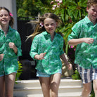 Childrens linen shirt in green floral Protea print by designer Lotty B for Pink House Mustique