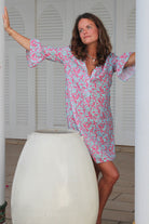 Women's linen dress with gathered sleevein turquoise blue and coral red Parrot print by designer Lotty B