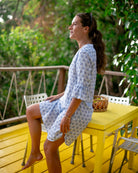 Resort style women's linen dress with frilled cuffs in blue Sand Dollar print, the Decima dress by Pink House