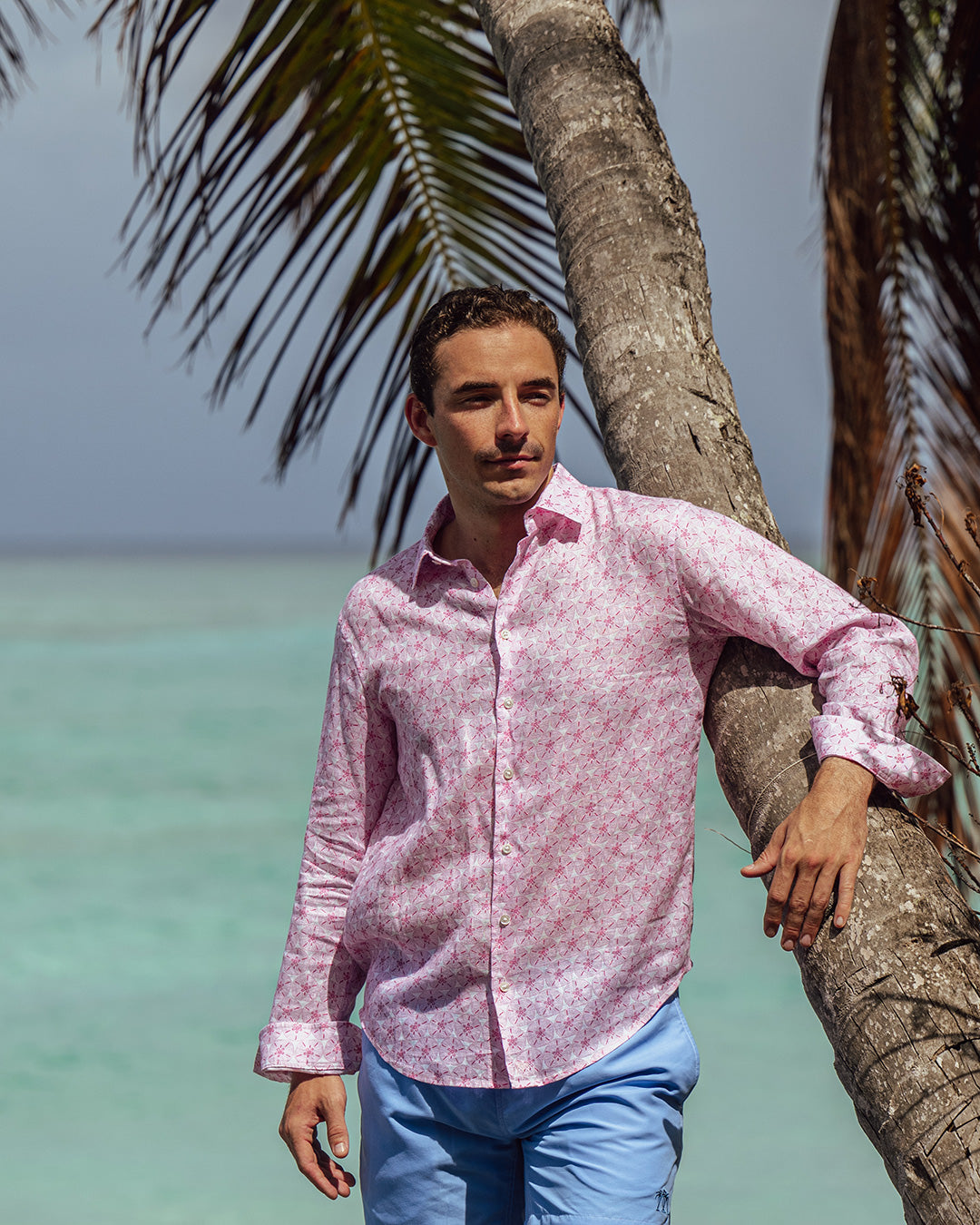 Beach lifestyle on Lagoon Bay, Mustique Island in a pink Sand Dollar pure linen shirt by designer Lotty B for Pink House