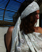 Vacation style head scarf, pure silk scarf in pale blue and taupe Sand Dollar print by designer Lotty B Mustique