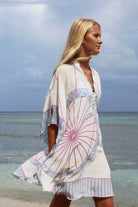 Lotty B Short Kaftan in Silk Crepe-de-Chine: BICYCLE - PINK walking Mustique beach