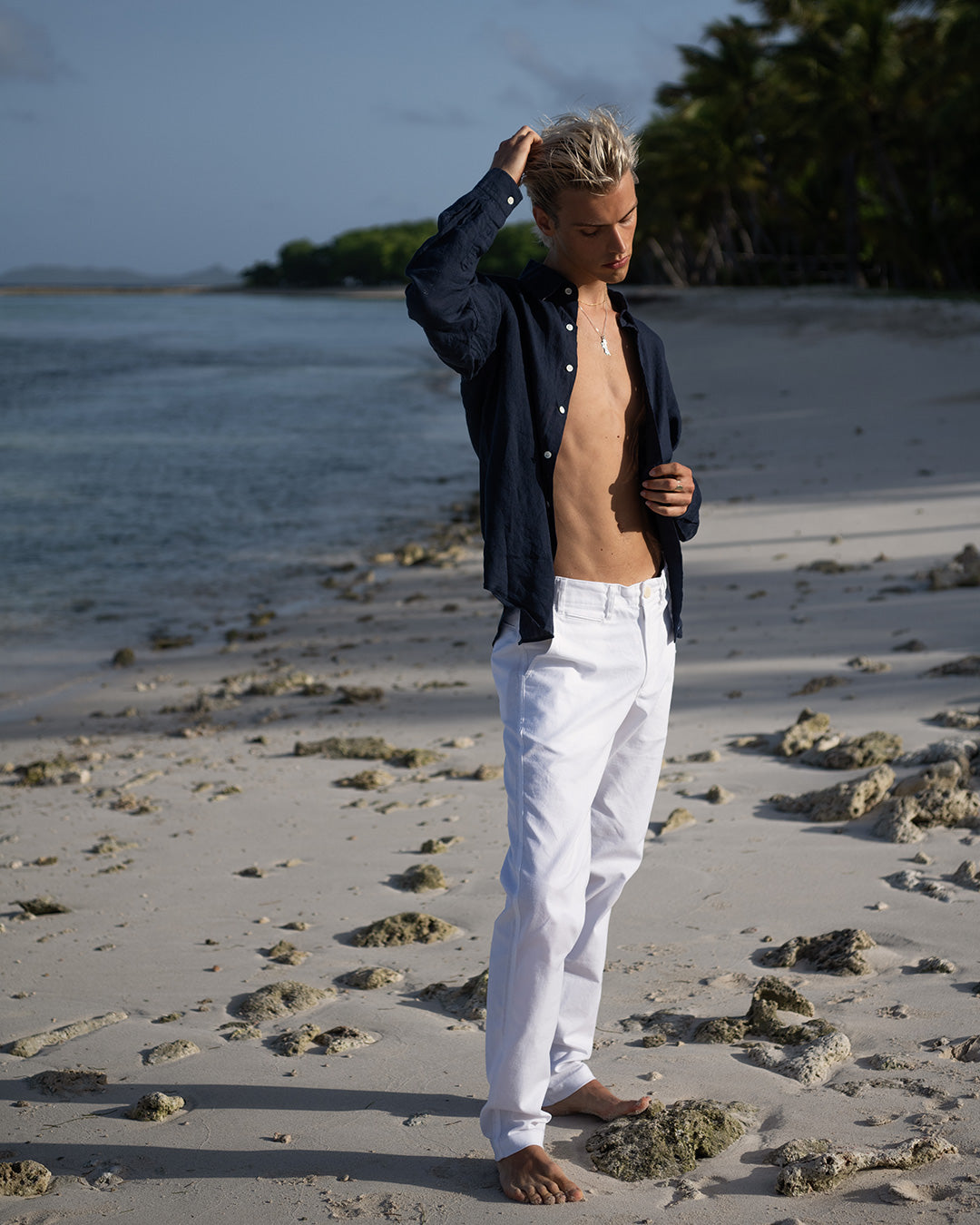 Tropical island vacation classic linen pants styled with Eclipse navy blue linen shirt. Designer linen resortwear by Pink House 