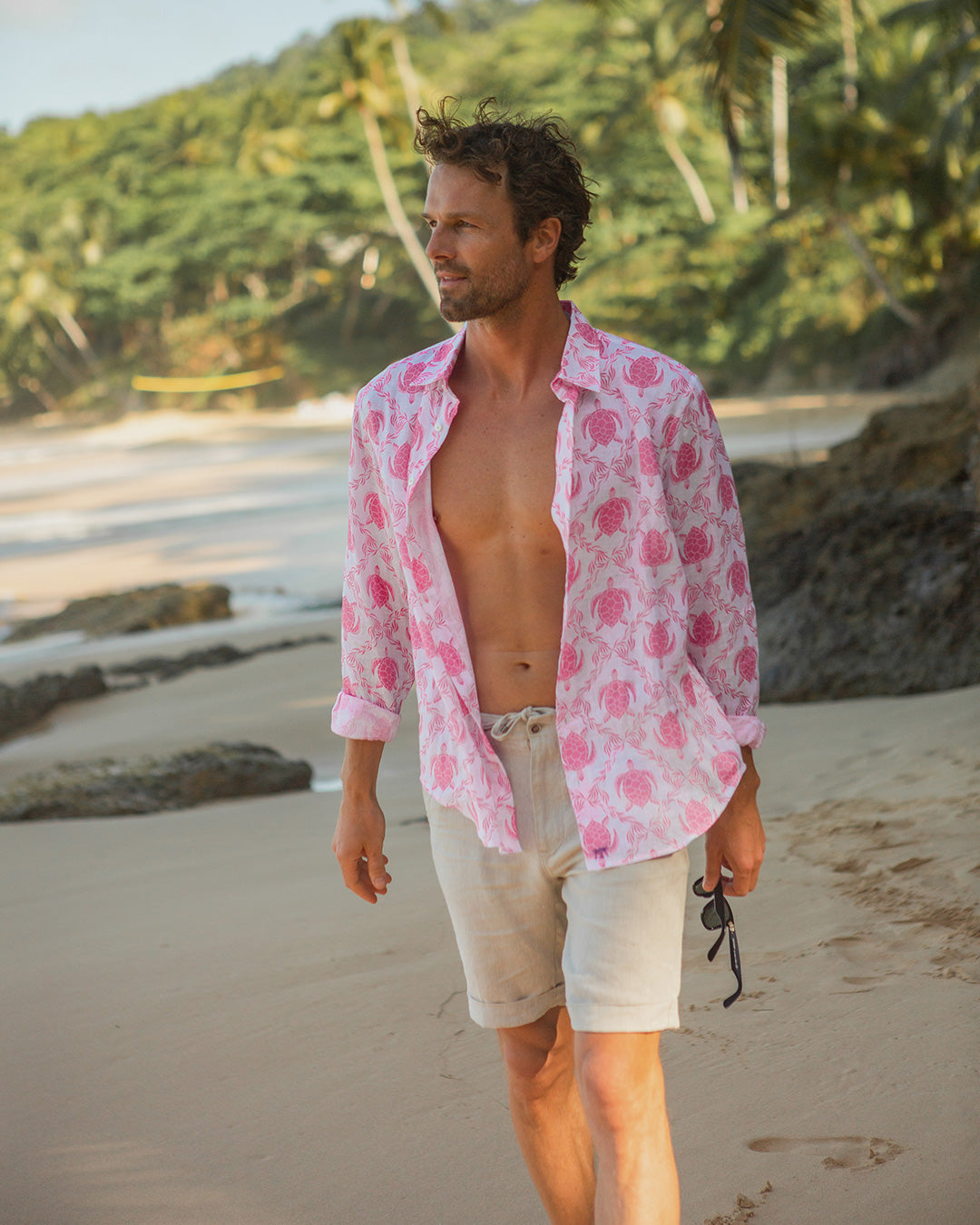 Luxury island vacation style casual linen shorts in natural beige worn with pink linen Turtle shirt by Pink House