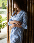 Women's easy travel linen dress in blue Sand Dollar print styled at Mustique airport by Pink House