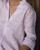 Close up of luxury quality V neck linen dress in pink Pangolin pattern by Pink House