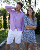 Mens plain white linen beach shorts worn with lilac linen shirt by Pink House