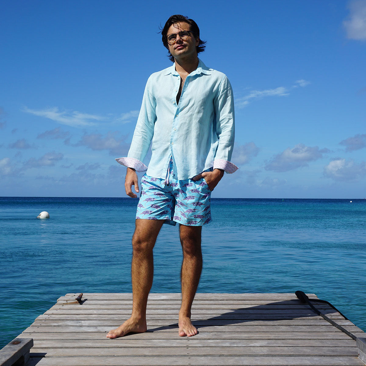 Sustainable Mens swim trunks in blue Egret bird print Cotton House pier, Mustique