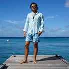 Sustainable Mens swim trunks in blue Egret bird print Cotton House pier, Mustique