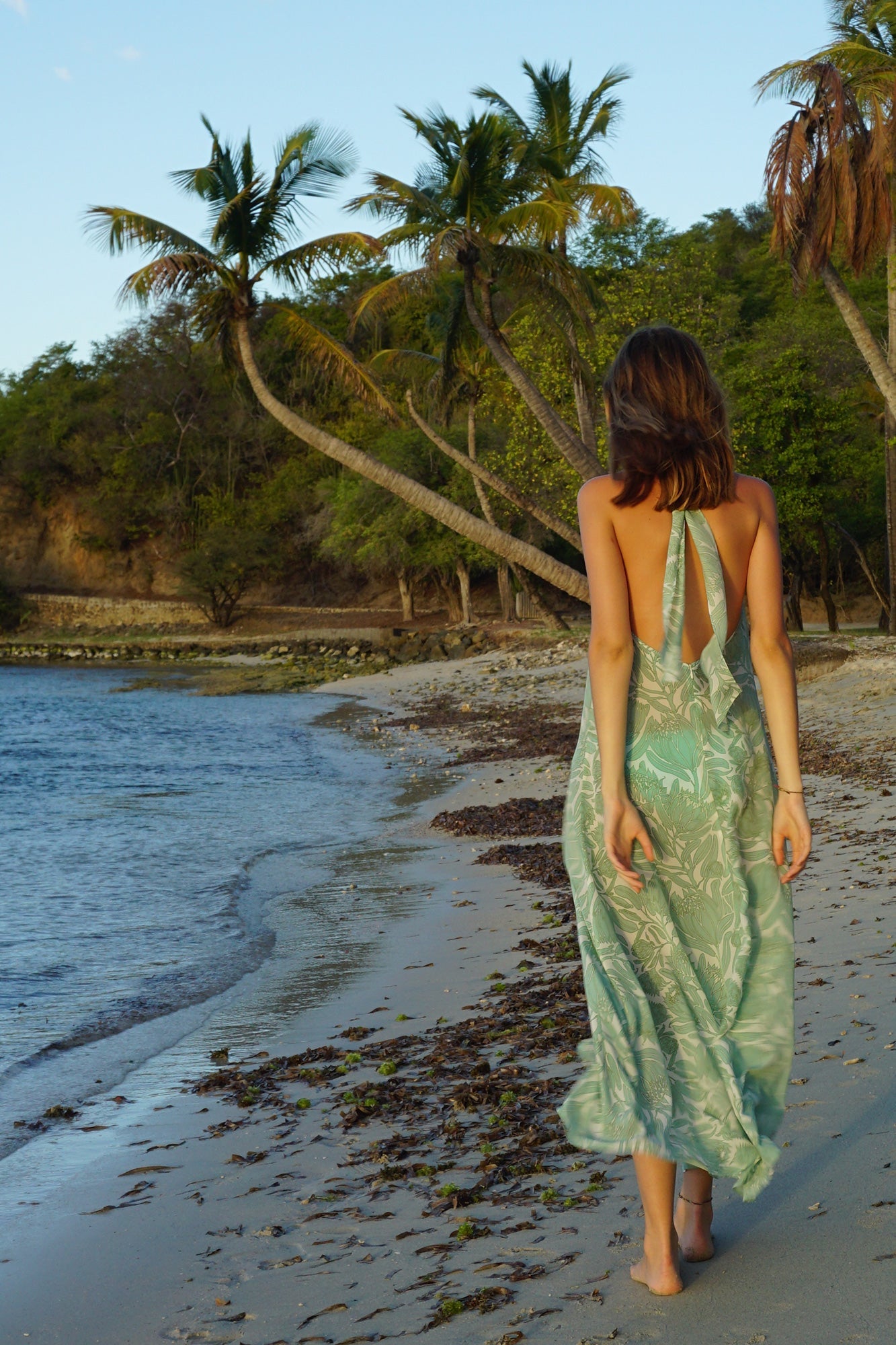 long silk backless Dena dress in green Protea print by Lotty B Mustique