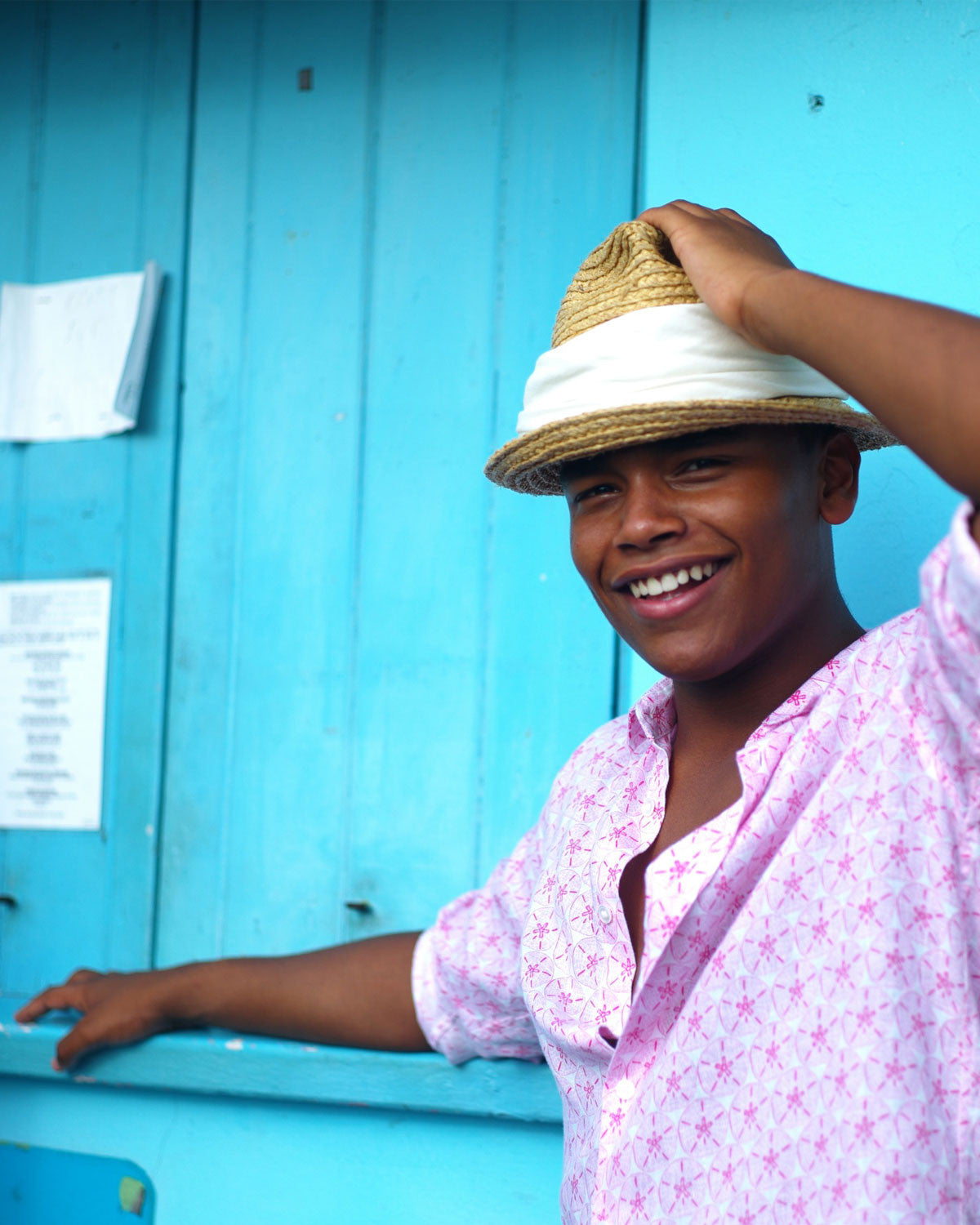 Mustique Island lifestyle in a pink Sand Dollar pure linen shirt by designer Lotty B at the dive shack, Cotton House Beach Mustique Island