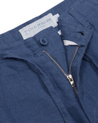 Button and front zip opening detail on pure linen casual shorts in mid blue by Pink House