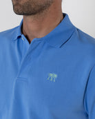 Mens premium pure cotton mid blue polo shirt with bright green Pink House logo embroidery