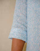 Close up detail of quality linen dress 3/4 length sleeve in light blue Sealeaf print