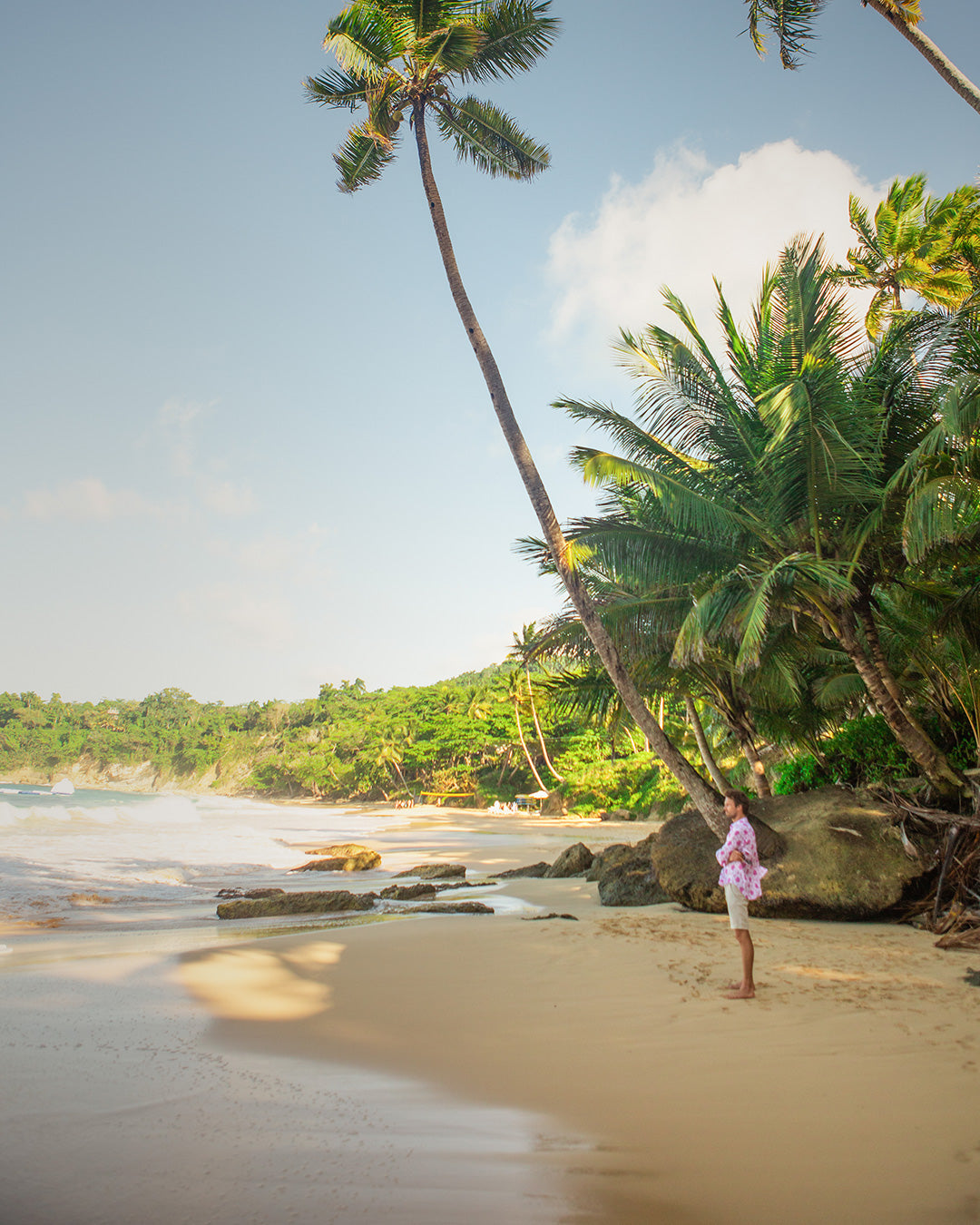 Mustique island travel fashion casual linen shorts in natural beige worn with pink linen Turtle shirt by Pink House