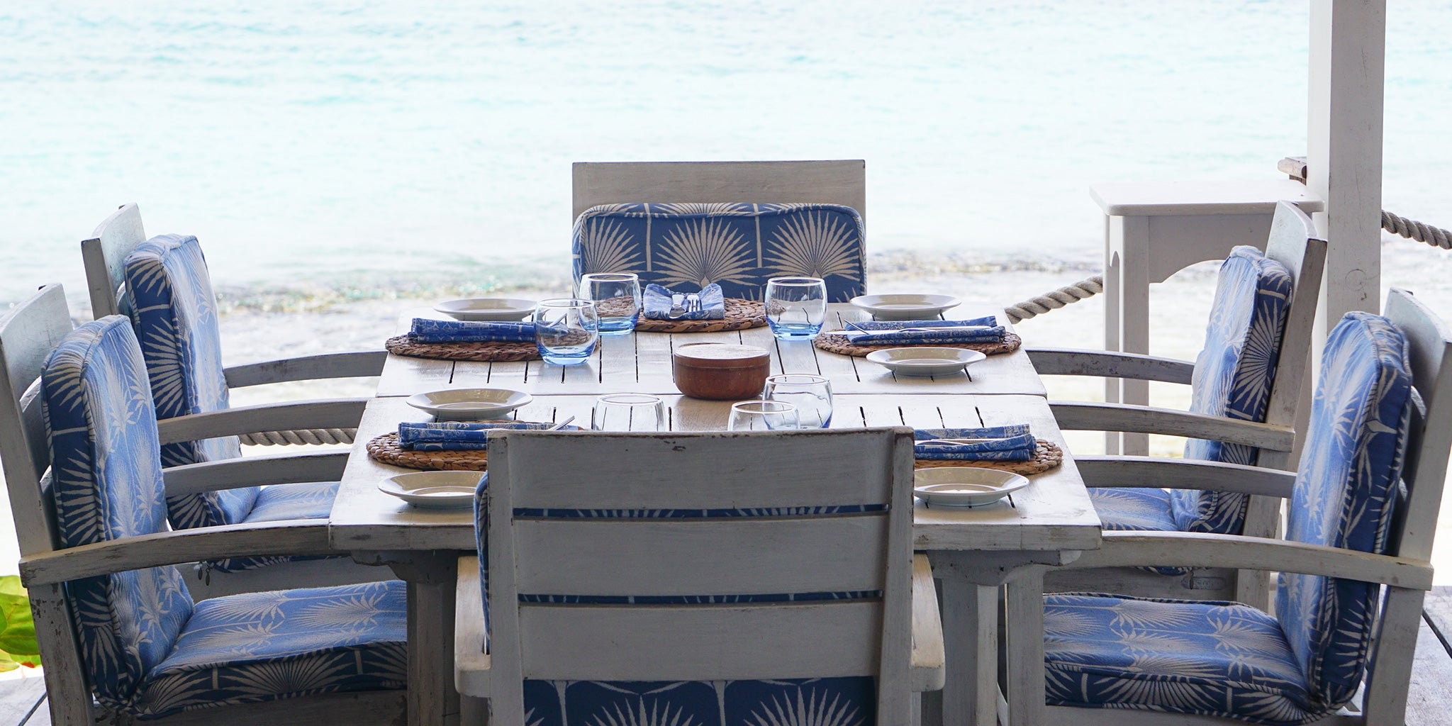 Lotty B's durable and easy to clean performance fabric in classic Pink House Fan Palm design at The Cotton House Hotel beach bar, Mustique Island