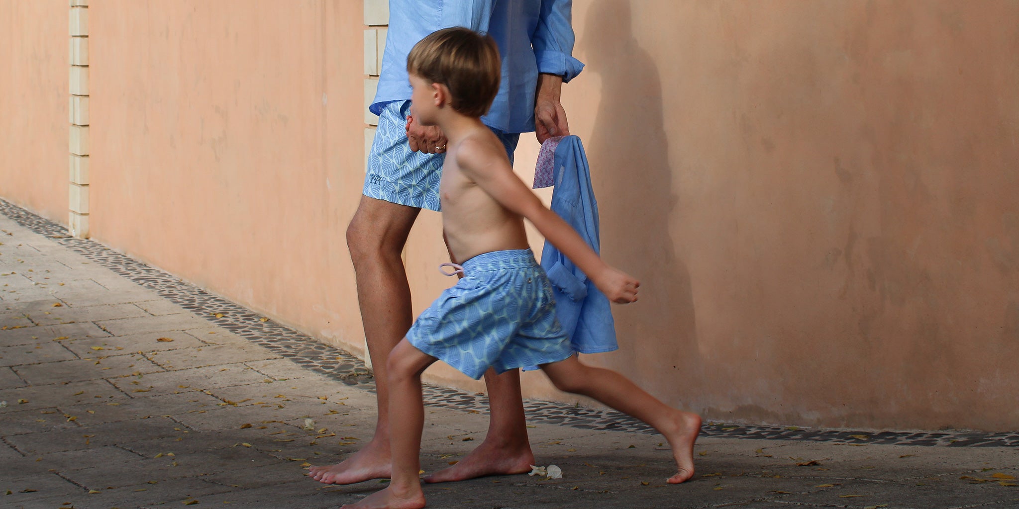 Best Fathers and Sons matching vacation clothing linen shirts and swim shorts in blue Striped Shell print by designer Lotty B