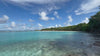 The ultimate have-to-hand holiday piece, a pure silk scarf or sarong by Lotty B makes for the perfect companion for the day. Gelliceaux beach, Mustique Island.