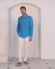 Video showing men's classic white linen pants styled with bright turquoise linen shirt by Pink House