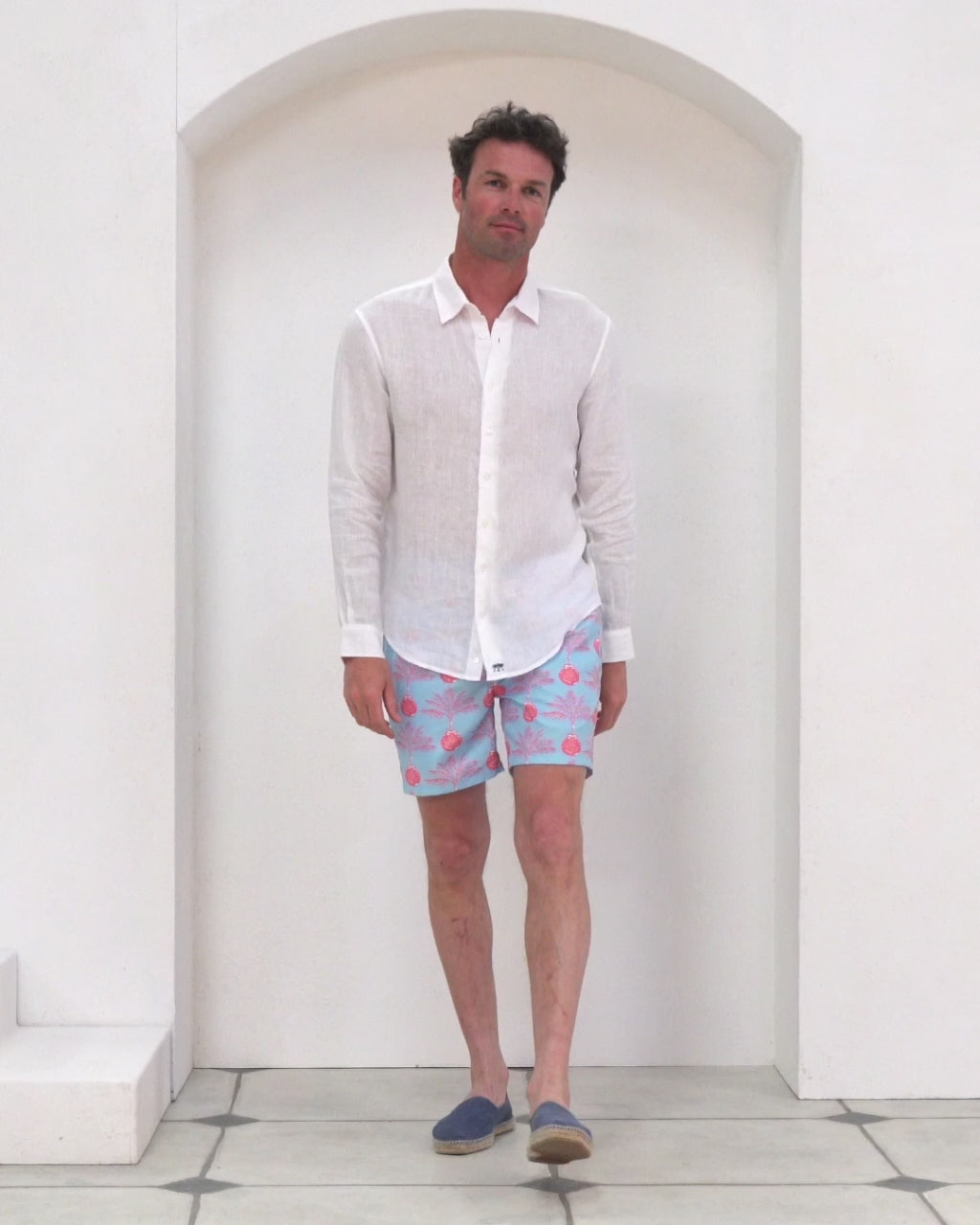 Stylish mens holiday essentials recycled swim shorts in Potted Palm coral turquoise by Pink House Mustique