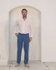 Perfect vacation style casual blue pure linen pants worn with pistachio green shirt by Pink House resortwear