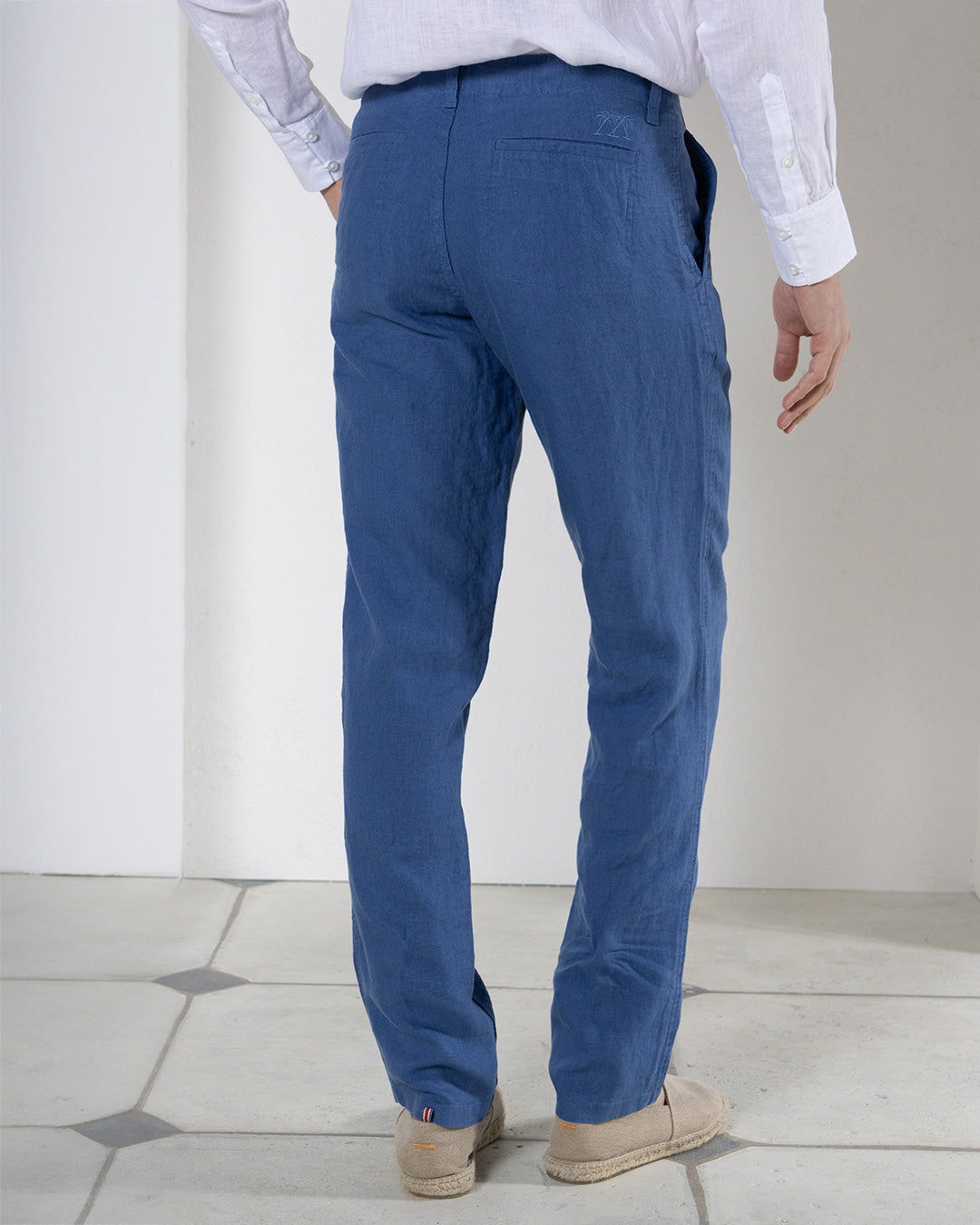 Comfortable island classics casual blue pure linen pants worn with collarless white shirt by Pink House resortwear