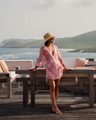 Vacation fashion, chiffon silk Kimono in coral pink Sand Dollar print by designer Lotty B, styled at Villa Taliesin Mustique Island