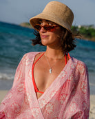 Elegant beach holiday style in coral pink Sand Dollar chiffon silk Kimono cover-up, Cotton House Hotel Mustique.