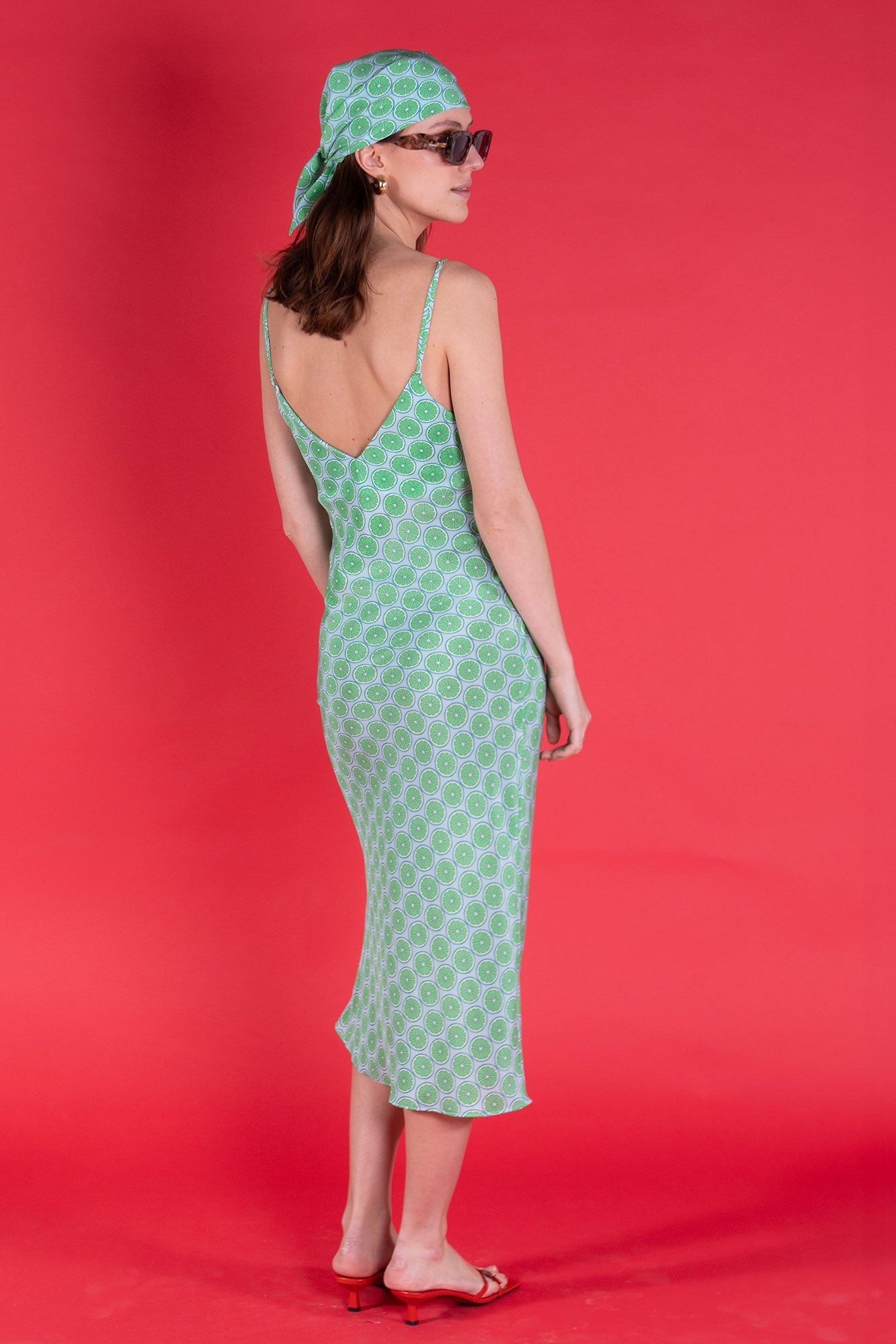 Made to order pure silk slip dress in lime slice green crepe de Chine designer Lotty B Mustique for Pink House Atelier Collections