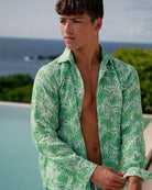 Mens designer vacation wear linen shirt in green & pale blue Protea print